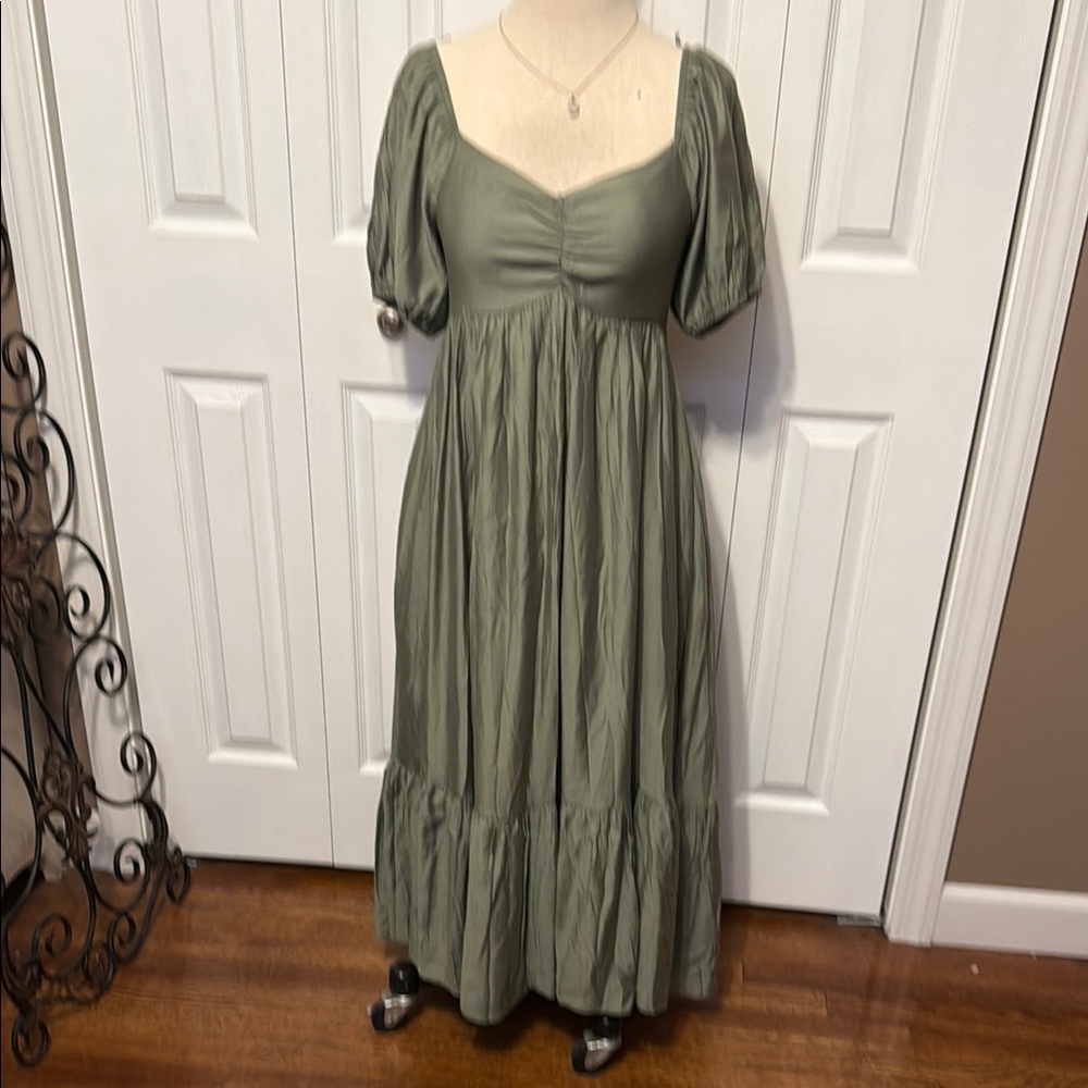 Beautiful flowing sage green dress with bottom ruffle. Size small NWT.